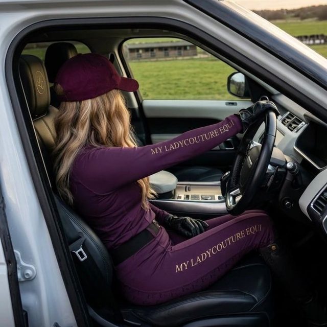 Rider in the plum My Lady set behind the wheel of a car